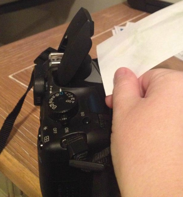 hold a piece of white paper in front of your camera to bounce the flash for better holiday photos