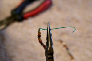 make a necklace for dolls